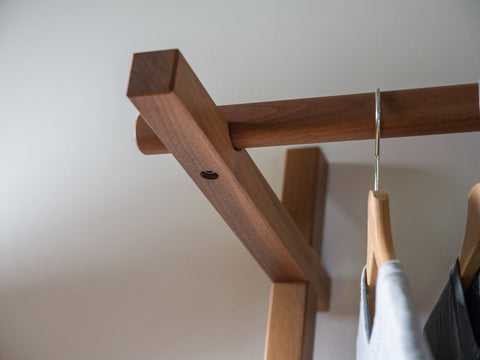 Walnut leaning clothes rack